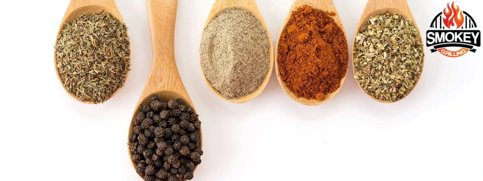 Five wooden spoons with different spices, including thyme, black peppercorns, ground pepper, paprika, and oregano, with a Smokey Grilling logo in the top right corner.